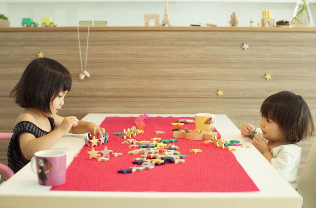 kids playing with star-shaped toys